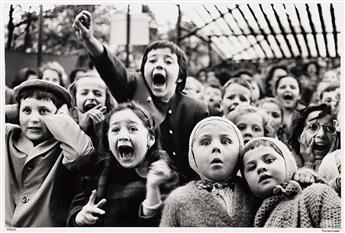 ALFRED EISENSTAEDT (1898-1995) Children at a Puppet Theater, Paris.                                                                              